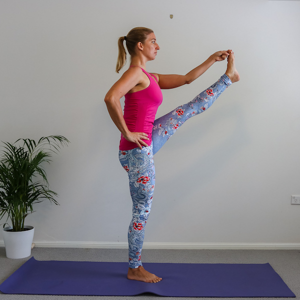 Yogi in Utthita hasta padangusthasana demonstrating flexibility